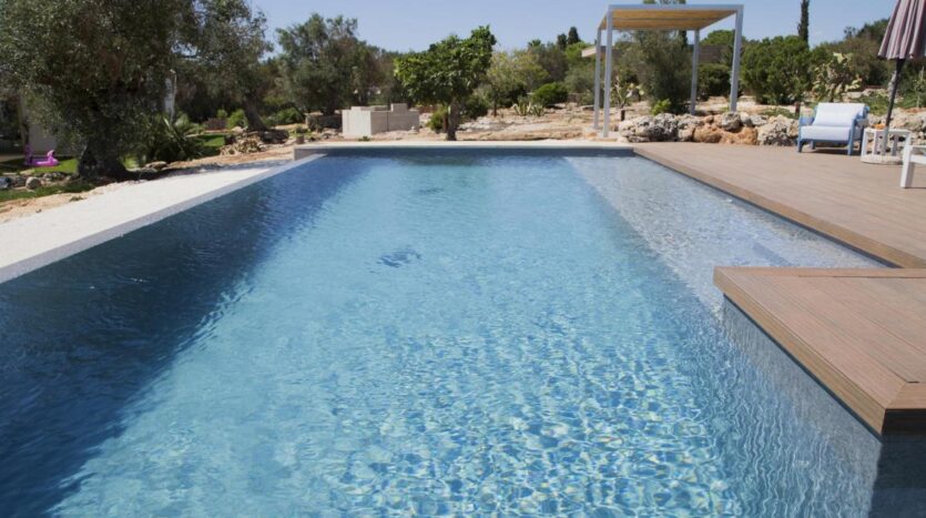 A refreshing pool area perfect for relaxing under the warm Apulian sun.